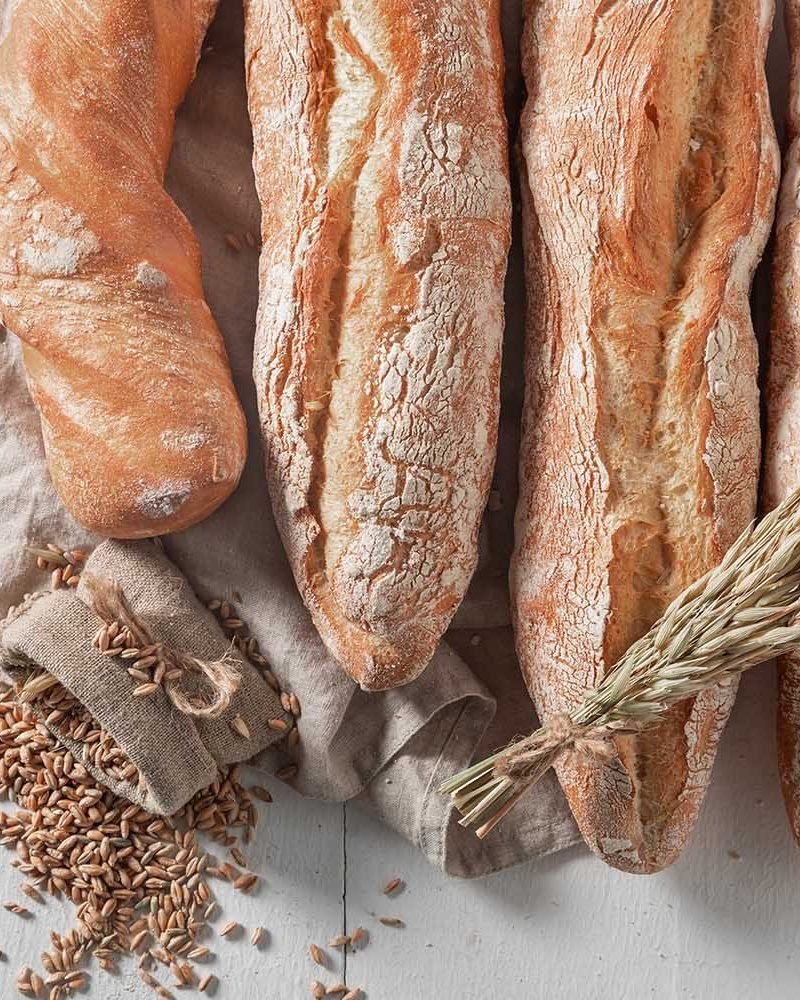 rustic-baguettes-baked-in-bakery-country-kitchen-FLZTJXD.jpg